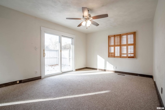 unfurnished room with carpet flooring and ceiling fan