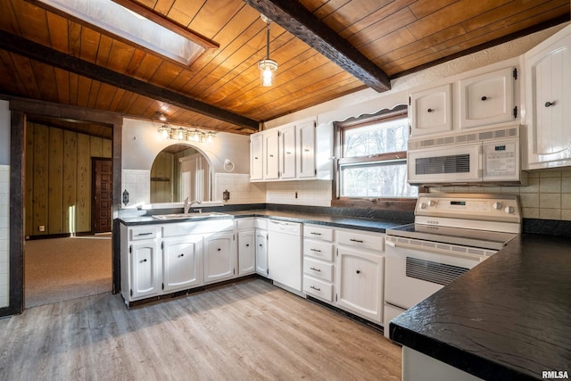 kitchen with wood ceiling, white appliances, sink, beam ceiling, and white cabinets