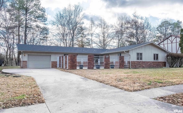 single story home with a front yard and a garage