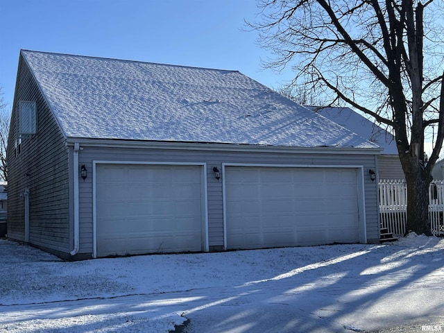 view of snow covered garage