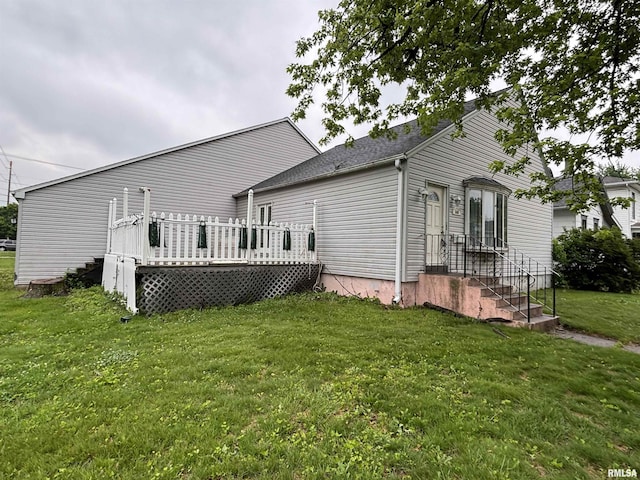 560 4th Ave S, Clinton, IA 52732 - back of property with a lawn and a deck
