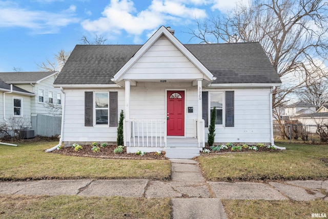 bungalow-style house featuring a porch and a front lawn