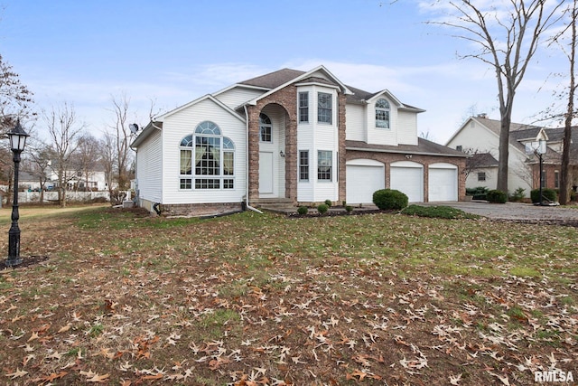 front of property with a front lawn and a garage