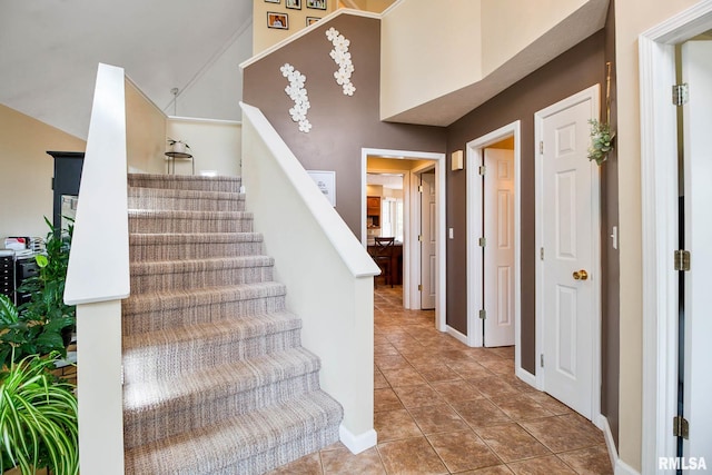 stairs featuring tile patterned floors