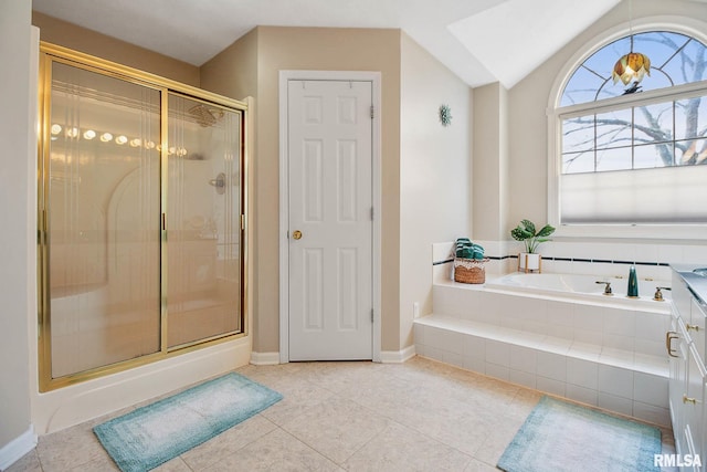 bathroom with tile patterned flooring, independent shower and bath, and lofted ceiling