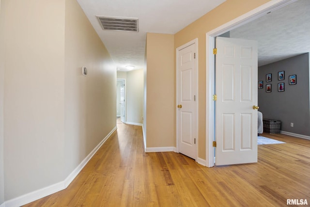 hall featuring light hardwood / wood-style floors