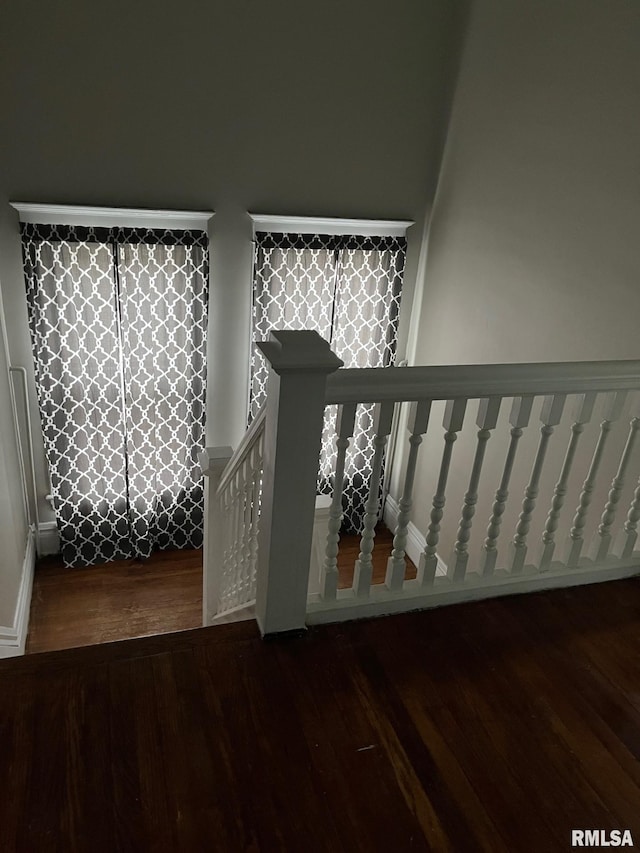 stairs featuring wood-type flooring