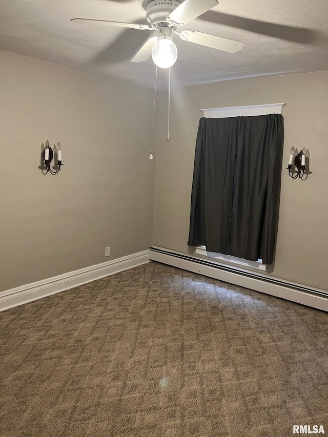 carpeted empty room featuring a baseboard radiator and ceiling fan