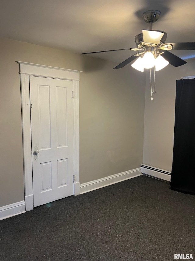 unfurnished bedroom with ceiling fan and a baseboard heating unit