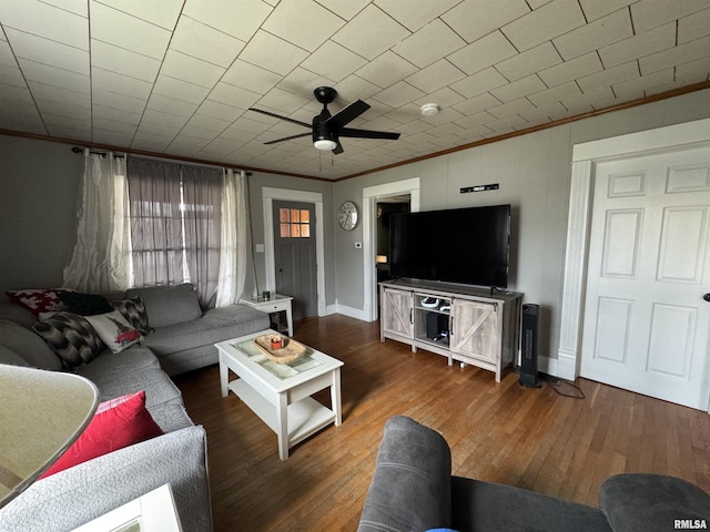 living room with ceiling fan, crown molding, and dark hardwood / wood-style floors