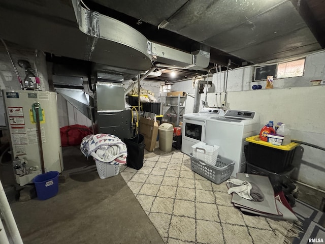 basement with gas water heater and washing machine and dryer