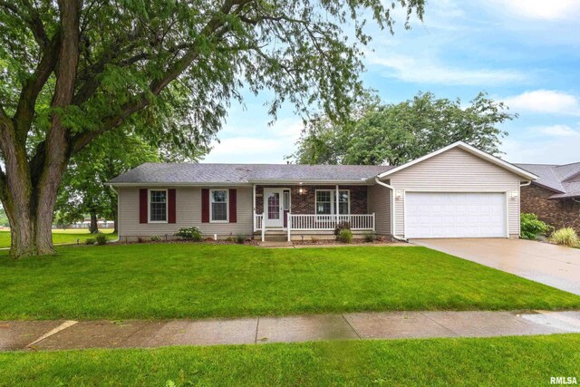 ranch-style house featuring a front lawn, a porch, and a garage