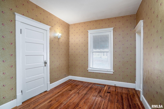 spare room featuring hardwood / wood-style flooring