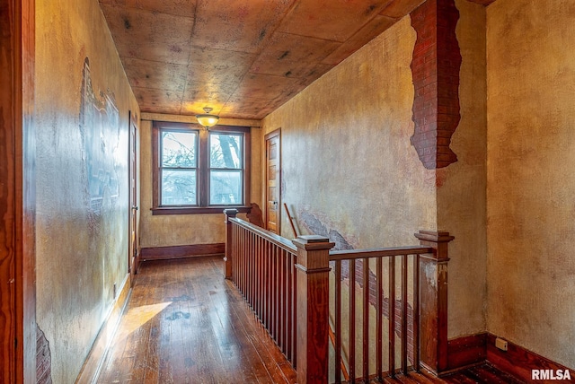 hallway with wood ceiling and hardwood / wood-style flooring