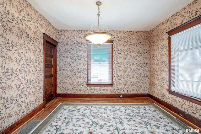 unfurnished room featuring hardwood / wood-style flooring