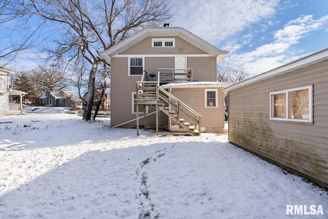 view of snow covered house