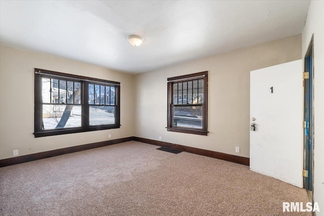 unfurnished room featuring carpet flooring