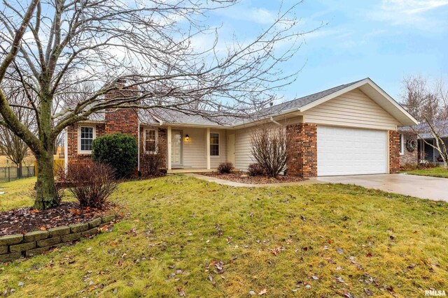 ranch-style home featuring a front lawn and a garage