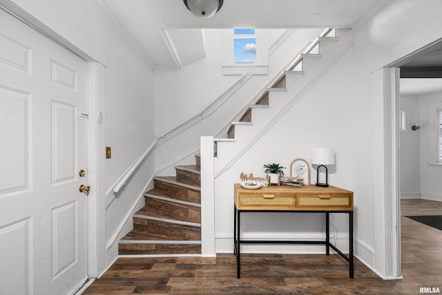 staircase featuring hardwood / wood-style flooring