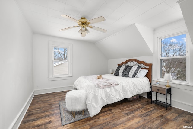 bedroom with vaulted ceiling, ceiling fan, and dark hardwood / wood-style floors