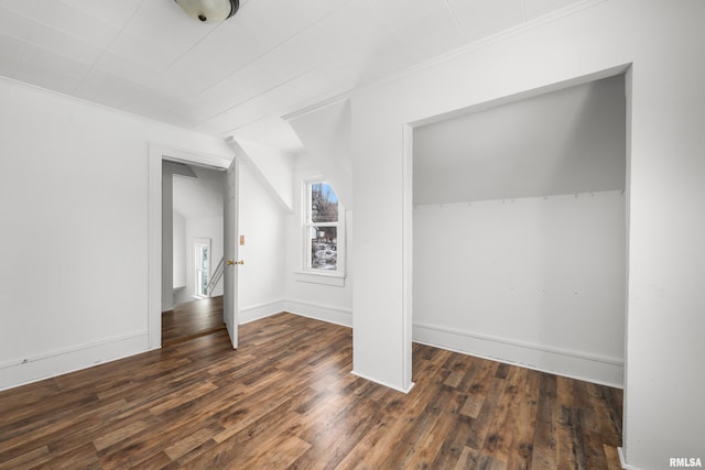 bonus room featuring dark wood-type flooring