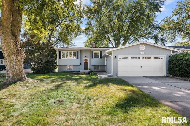 view of front of property with a front yard and a garage