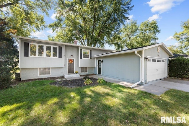 view of front of property with a front lawn and a garage