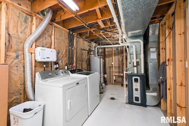 laundry room with washer and dryer and gas water heater