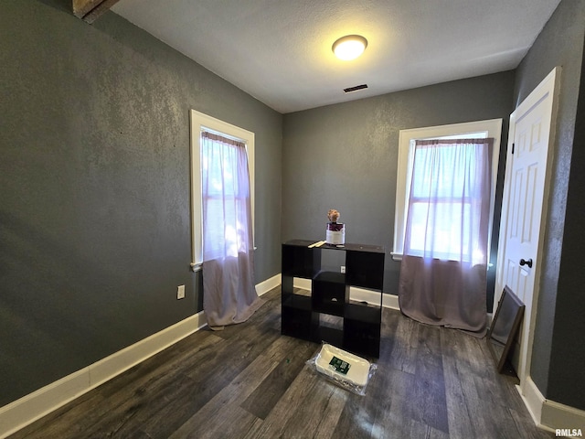 dining space with dark hardwood / wood-style floors