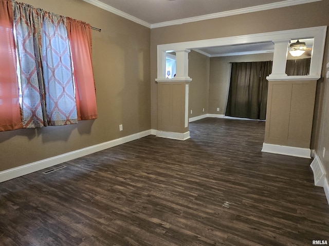 empty room featuring dark hardwood / wood-style floors, ceiling fan, and ornamental molding