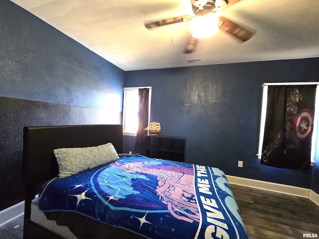 bedroom featuring wood-type flooring and ceiling fan