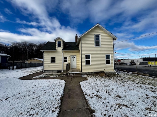 view of snow covered house