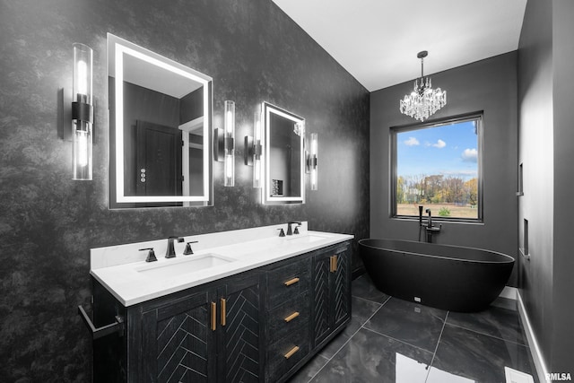 bathroom featuring vanity, a tub, and a notable chandelier