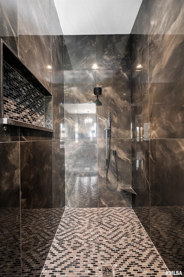 bathroom with a tile shower