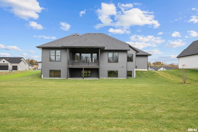 rear view of property with a lawn