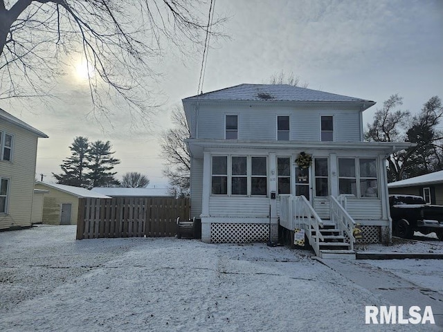 view of front of property featuring a sunroom