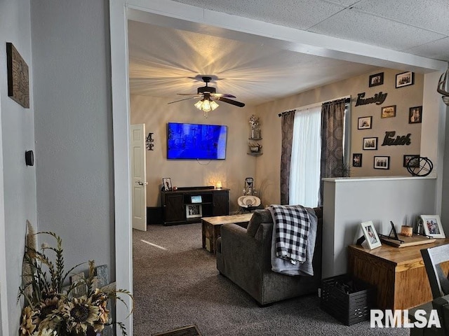 living room with carpet flooring and ceiling fan