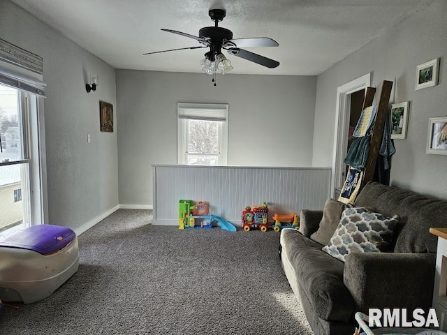 rec room with carpet flooring, a textured ceiling, and ceiling fan