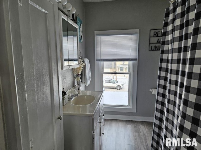 bathroom with vanity and wood-type flooring