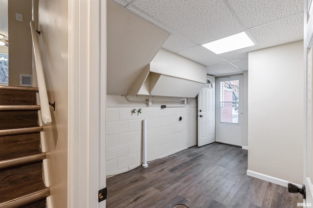 clothes washing area featuring dark wood-type flooring