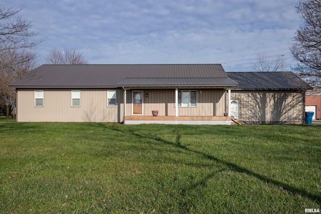 rear view of house with a yard