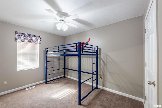 carpeted bedroom featuring ceiling fan