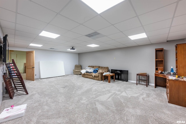 sitting room with a paneled ceiling and light colored carpet