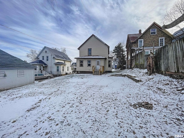 view of snow covered house