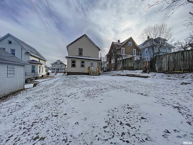 view of snow covered house