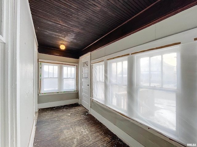 unfurnished sunroom featuring wooden ceiling