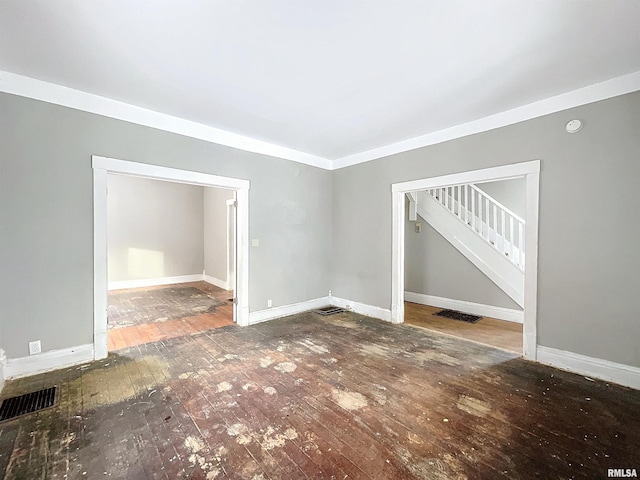 spare room featuring wood-type flooring