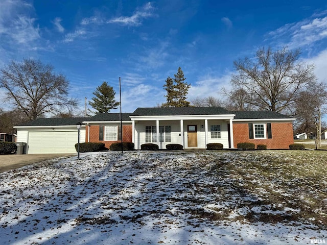 view of front facade featuring covered porch and a garage