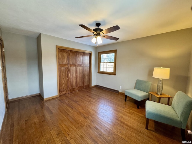 unfurnished room featuring baseboard heating, ceiling fan, and hardwood / wood-style floors