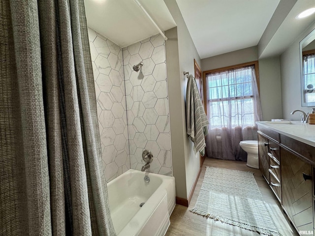 full bathroom featuring vanity, toilet, and shower / bath combo with shower curtain